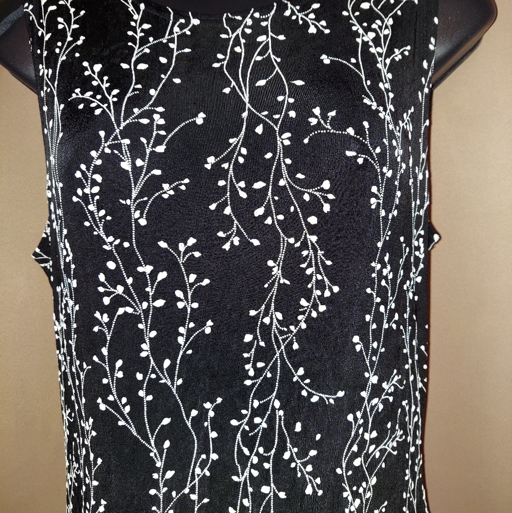 Sleeveless long black dress with white ivy design